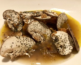 Foie gras poached in sea urchin jus w dates, mushrooms from Savoie with the taste of the sea