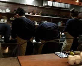 Counter seating with a view of the chefs preparing all the dishes 