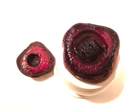 Small birchgrilled beet in a bigger beet, oxtail fat and black currant 