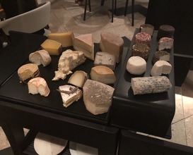 Selection of cheese served with two wines 