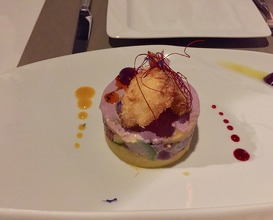 Causa with octopus in olive sauce