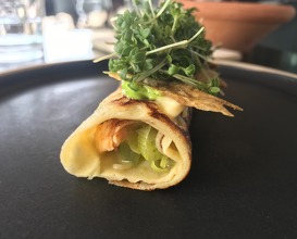 Pancake with fried langoustine, chicken skin and cucumber