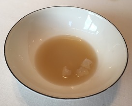 Prawn consommé, cream of coco and curry