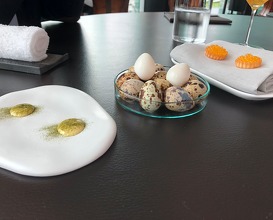 Quail egg with wild garlic, tartelette with yoghurt and char caviar