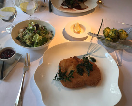 "Wiener Schnitzel" from veal with parsley- tomatoes, berries and cabbage mayonnaise