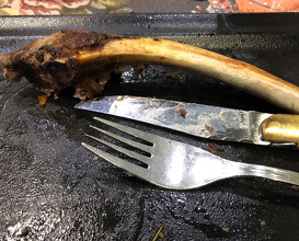 Grilled cowboy steak - a bone in ribeye steak cut from young veal