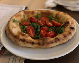Focaccia with arugula and cherry tomatoes
