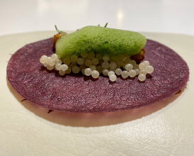 "TACO-CREPE" OF PURPLE CORN WITH CRUNCHY DUCK TONGUES, CUCUMBER & "GUISANTE LAGRIMA" IN THE WOK.