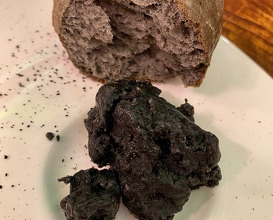 Bread with natural yeast and active charcoal from eggplant. The butter is made from the same charcoal and with the fish oil of belted bonito (Garum).