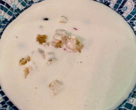 Ajo Blanco is an almond milk soup with some garlic, bread, olive oil, smoked ham and grapes