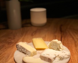 Selection of cheese served with two wines 