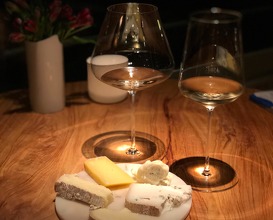Selection of cheese served with two wines 